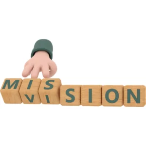 Defining the company mission and strategic goals, shown with wooden blocks spelling "MISSION," by a Freelance Brand Consultant.